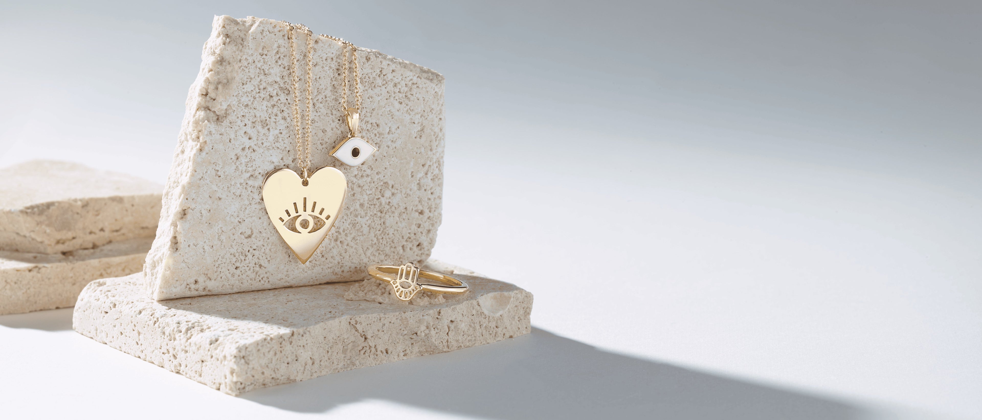 Gold fashion jewelry on sandstone